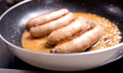 Sausages cooking