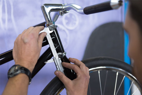 Close-up of masters hands taking measurments
