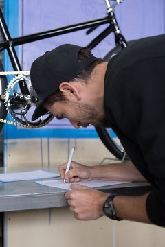 Close-up of bearded man doing drawing