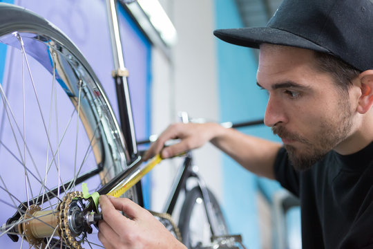 Close-up of bearded man taking measurements