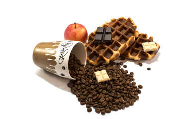 Fresh belgian waffles with cup full of coffee beans on white bac
