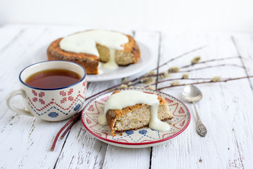 Banana cake with cottage cheese in a creamy sauce with a Cup of