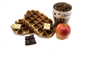 Waffles with chocolate and apples and coffe beans on white backg