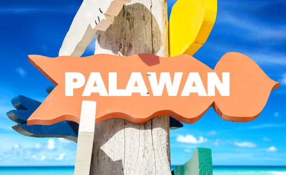 Palawan signpost with beach background