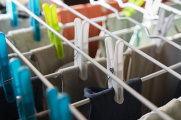 clothes drying on a dryer with clothespins