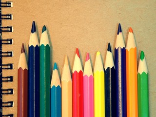 Close up colored pencils on the book