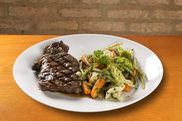 Grilled steaks and vegetables
