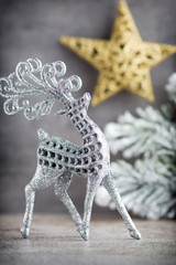 Silver deer on gray background. Christmas background.