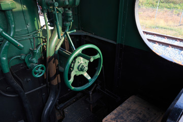 Details of a vintage steam train driving cabin.