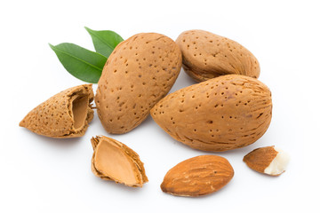 Almonds with leaves isolated on white background