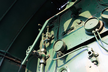 Details of a vintage steam train driving cabin.