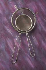 Pair of empty metal kitchen sieves