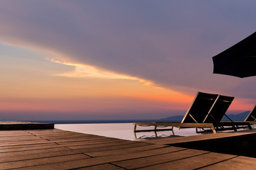 Luxury infinity pool with sunbed and terrace