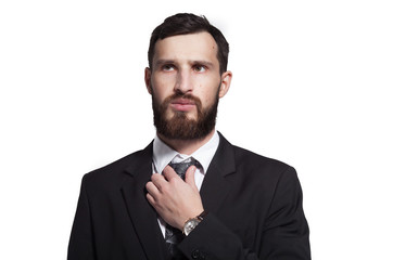 Close up portrait of a young bearded businessman on white background