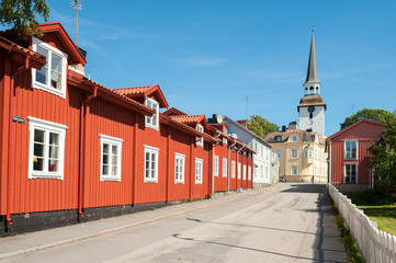 Obraz premium Vintage architecture during summer in idyllic small town Mariefred. This historic town on Lake Malaren is a popular tourist destination in Sweden