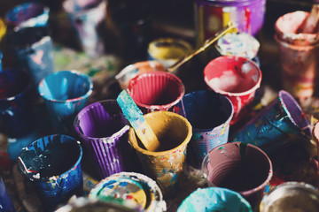 multicolored cans with paint, arts background