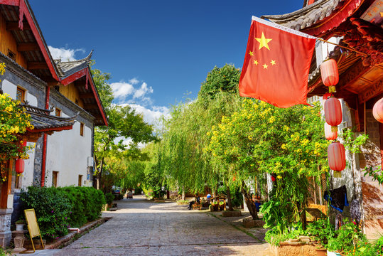 Fototapeta The flag of China (red flag with five golden stars), Lijiang