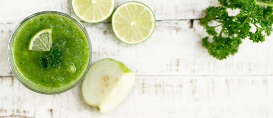 Green healthy drink over blurred background