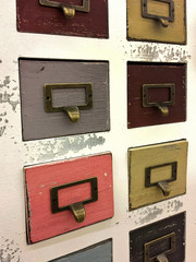 colorful vintage filing cabinet with brass plate