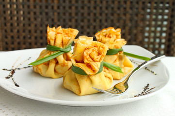 pancakes stuffed with meat tied bag