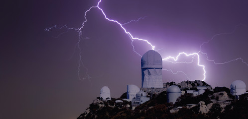 A Bolt of Lightning Over an Observatory