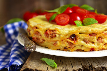 Lasagna pie with chicken and dried mushrooms.