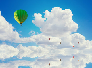 colorful hot air balloons flying over water