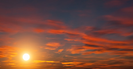 Fototapeta premium dramatic sunset background with orange clouds