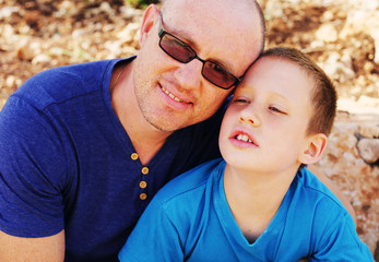 Fototapeta premium Portrait of father with son outdoors