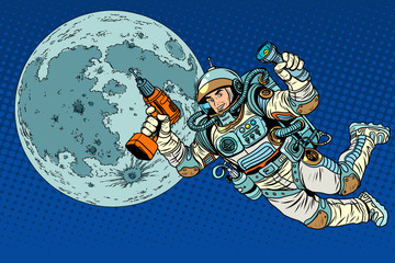 Fototapeta premium Astronaut with a drill and flashlight on the Moon