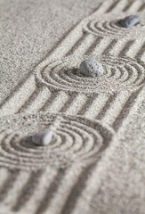 Fototapeta na wymiar Stones and circles in the sand.