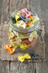 colorful pasta on wooden surface