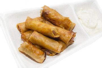 fried rolls with garlic sauce on a white background