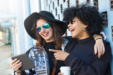 friends on the street with the tablet