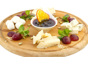 cheese plate with a large decorated the assortment of mint