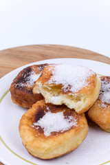 Homemade donuts with sugar over white background