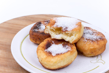 Obraz na płótnie Canvas Homemade donuts with sugar over white background