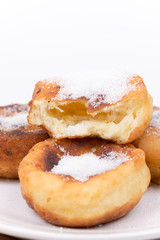 Homemade donuts with sugar over white background