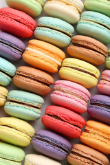 French colorful macarons background, close up