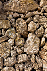 Nature stone wall of crushed stone, background