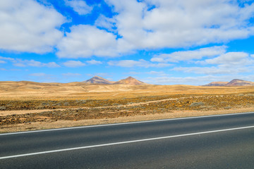 Road to Corralejo along desert with volcanoes, Fuerteventura, Canary Islands, Spain