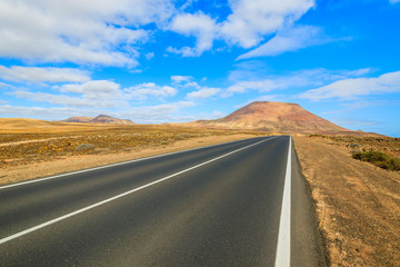 Road to Corralejo along desert with volcanoes, Fuerteventura, Canary Islands, Spain