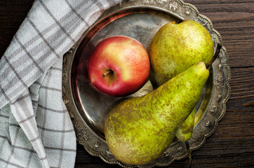 Fruit-piece with napkin on wooden background