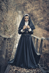 One pretty,sexy nun,cute nun,peaceful nun,alone,posing nun,attractive nun,young nun,holy nun,sister...
