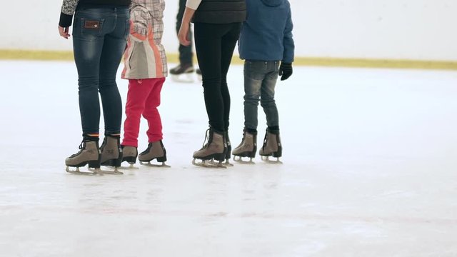 People skating at rink. Slow motion