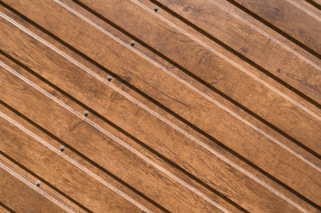 Fototapeta premium Brown siding that mimics the natural wood