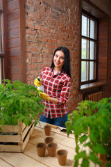 Portrait of a charming young female gardening