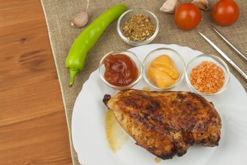 Chicken steak with vegetables. Grilled chicken breasts. Dietary meat on the grill. Chicken fried steak. 
