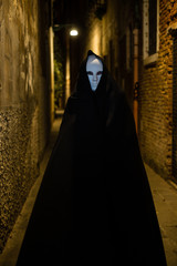 Woman in dark halloween like costume