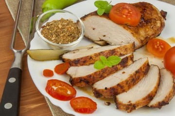 Chicken steak with vegetables. Grilled chicken breasts. Dietary meat on the grill. Chicken fried steak. 
